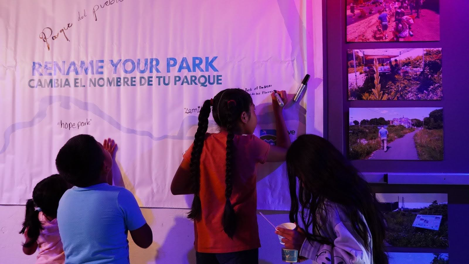 Children at an event in New Haven writing on a poster that reads Rename Your Park