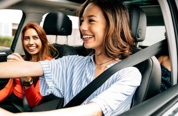 women in a car together